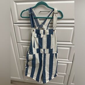 Levi’s striped blue jean and white overalls
